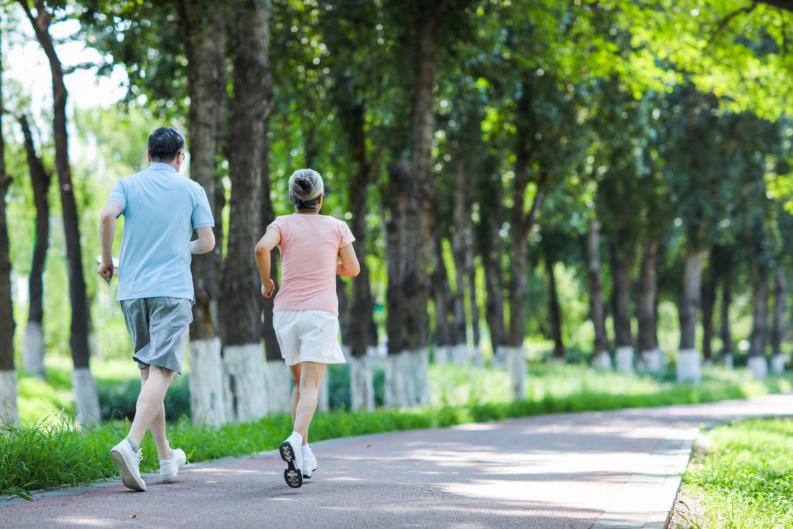 Senior couple jogging in outdoor park